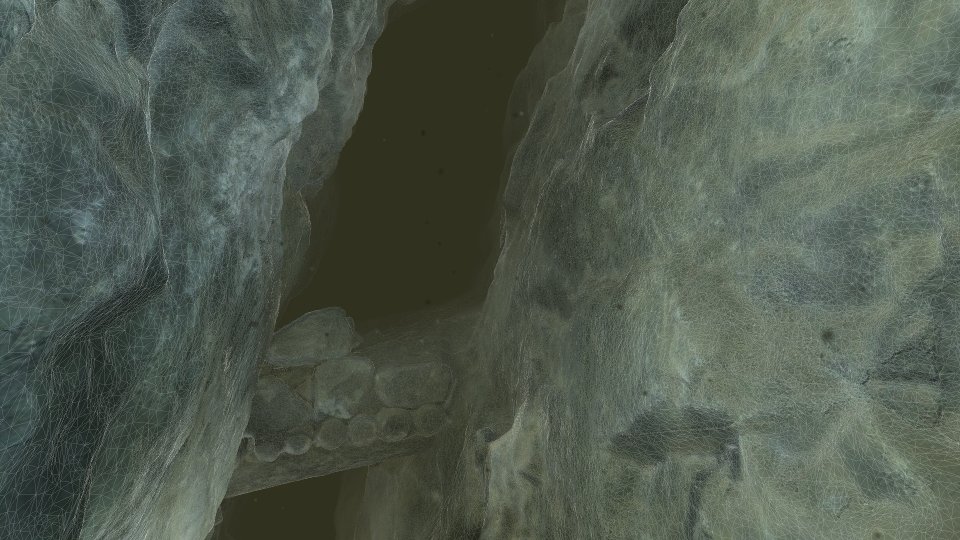 Wireframe drawn over the textured rock, the triangles visibly finer close to the camera